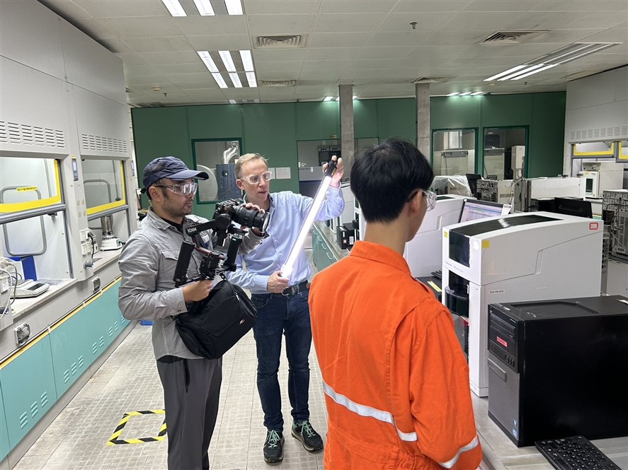 Industrial filming crew working inside a technical facility in Shanghai