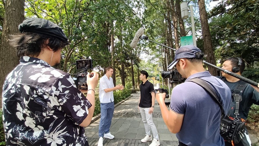 Location sound mixer supporting an outdoor interview shoot in Shanghai