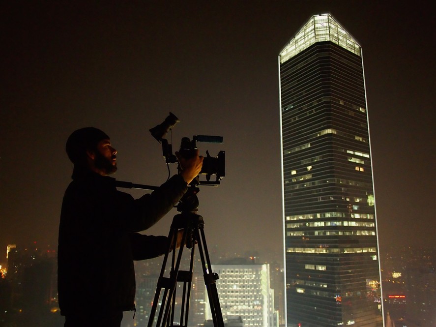 Cinema camera setup filming the Shanghai skyline at night